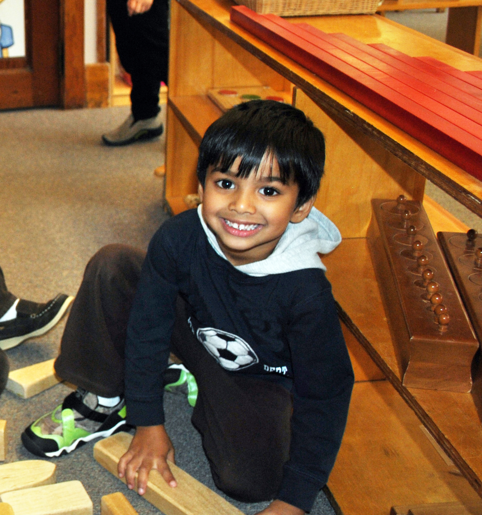 A child working with Montessori classroom materials.